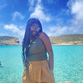 girl standing in front of water 